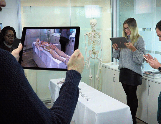  A group of students showing Visualization of Complete Anatomy augmented reality mode