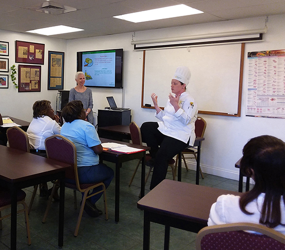 Chef providing classroom instruction for meal preparation