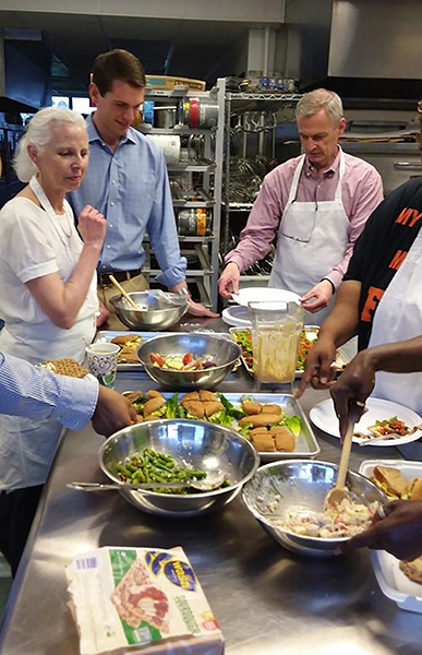 Culinary medicine instructors, librarian, and participants share meal